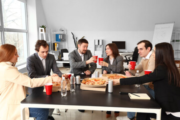 Group of business people with cola and tasty pizza in office