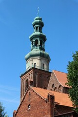 Baroque superstructure of a gothic tower co-cathedral basilica of the Holy Trinity in Chelmza