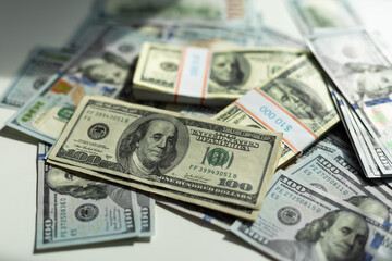 Background of a modern 100 dollar bills, large picture of the stack of hundred dollars