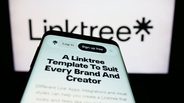 Stuttgart, Germany - 07-09-2023: Mobile phone with webpage of Australian Internet company Linktree Pty. Ltd. on screen in front of logo. Focus on top-left of phone display.