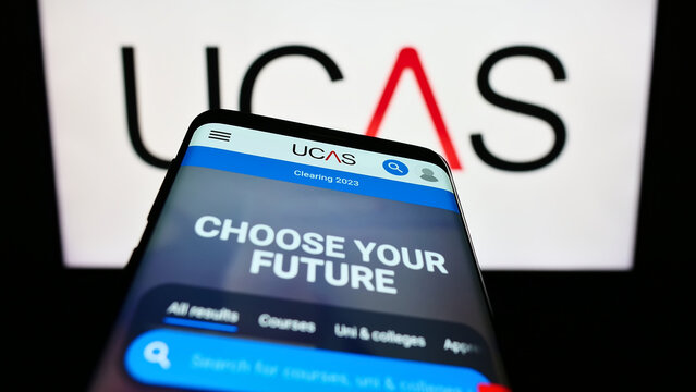 Stuttgart, Germany - 07-09-2023: Mobile phone with website of Universities and Colleges Admissions Service (UCAS) on screen in front of logo. Focus on top-left of phone display.