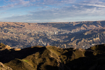 View from the landmark Muela del Diablo over the highest administrative capital, the vibrant city La Paz in Bolivia - traveling and exploring South America