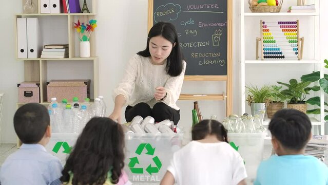 Asian female teacher teaches students about recycling. zero waste, ecological friendly and saving the environment concept.