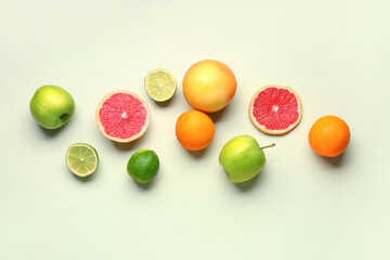 Naklejka na ściany i meble Different fresh fruits on green background
