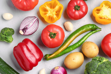 Different fresh vegetables on grey background