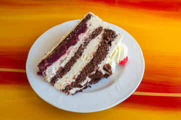 The famous German Black Forest cake, sweet speciality in the region Schwarzwald. Main ingredients of the cake are milk cream, chocolate dough and cherries.