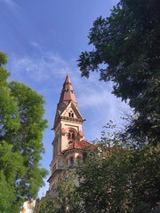 Fototapeta na wymiar Church of St. Paul in Odessa against the blue sky surrounded by trees