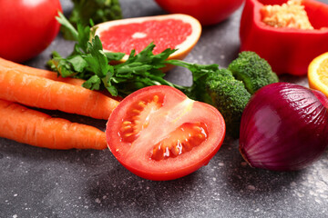 Different fresh vegetables on grey background