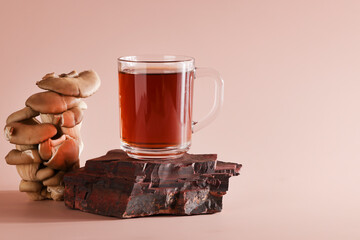 Natural medicine, reduce stress and improve immunity concept. Mushroom hot drink. Tea in stone...