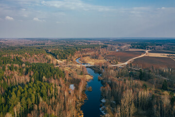 Aerial view of countryside village and bridge over river