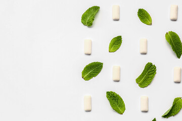 Fresh chewing gums with mint on white background