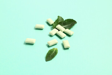 Fresh chewing gums with mint on turquoise background