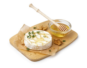 Wooden board of tasty baked Camembert cheese with honey on white background