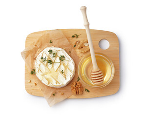 Wooden board of tasty baked Camembert cheese with honey on white background