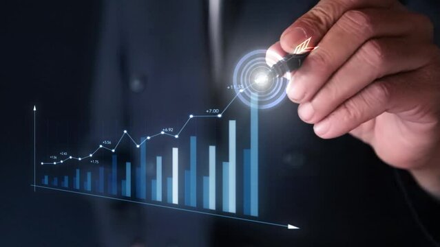 Businessman analyzing company financial balance sheet working with digital virtual graphics Businessman calculating financial data for long term investment growth goals.