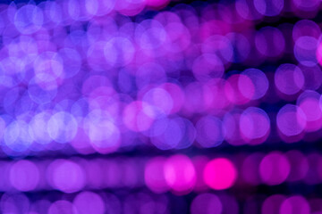 View to the purple and blue abstract bokeh light circles with black background