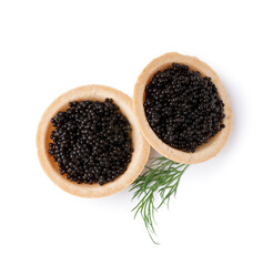 Tasty tartlets with black caviar on white background