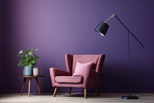 In the inside of a living room with a leather armchair, carpet, floor lamp, and coffee table on hardwood flooring, there are three blank vertical posters on a violet concrete wall.