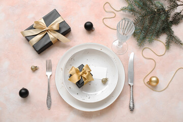 Beautiful table setting for Christmas celebration on beige background