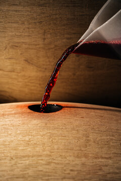 Close-up Motion Capture of Cabernet Being Poured into an Oak Barrel at a California Winery 
