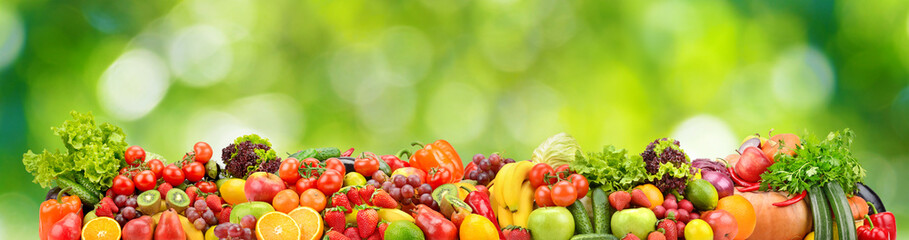 Collage fresh colored vegetables, fruits, berries on green background. - 625697080