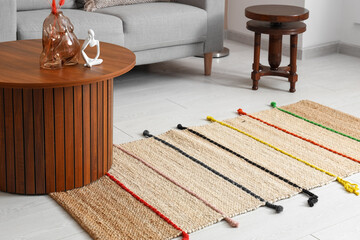 Stylish rug in interior of living room