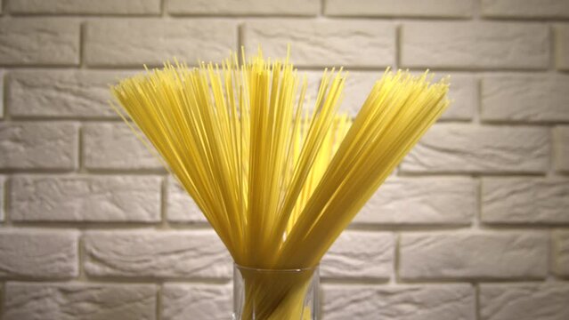 Top view A pack of uncooked spaghetti abstract background of spaghetti pasta rotating close up
