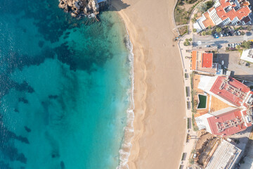 Aerial photograph of Cala San Vicente in Ibiza, capturing the beautiful beach and blue sea