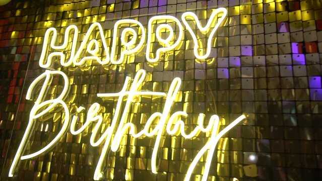 Neon inscription happy birthday. Slow motion