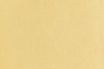 Texture background of yellow cotton fabric. Textile structure, cloth surface, weaving of linen fabric closeup, backdrop, wallpaper.