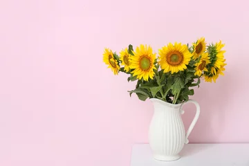 Rolgordijnen Vase with sunflowers on shelf near pink wall © Pixel-Shot