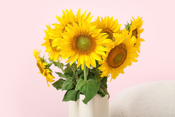 Vase with sunflowers in living room, closeup