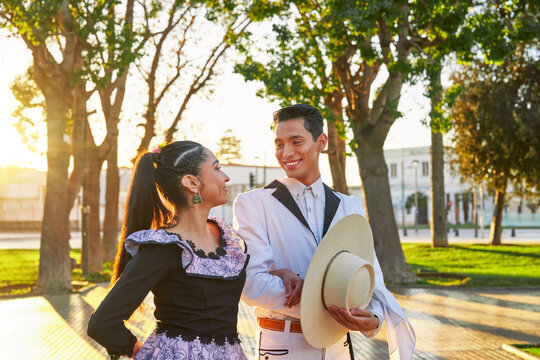 portrait young latin american couple looking at each other smiling dressed as huaso to dance cueca in the square