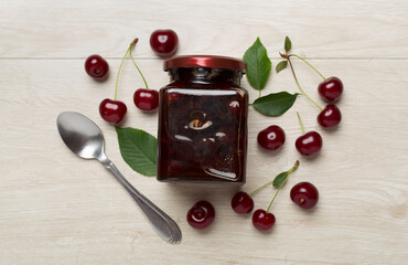 Flat lay with cherry jam on wooden backgroung