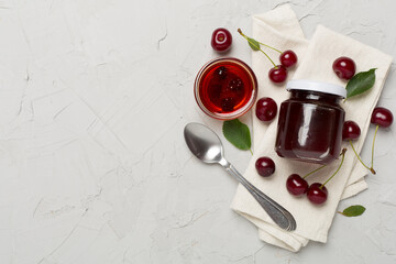 Flat lay with cherry jam on concrete backgroung