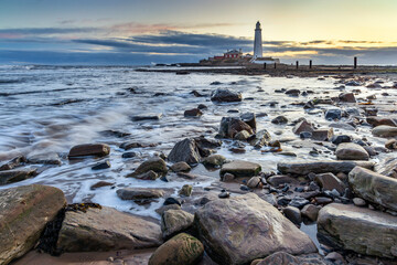 Fototapeta na wymiar Sunrise at St. Mary's Lighthouse at Whitley Bay, North Tyneside, England. 