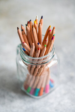 Set of multicolored pencils in glass jar
