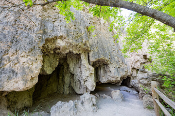 Sunny view of the cave landscape of the Rifle Falls