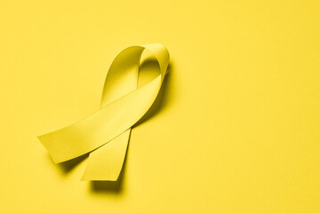 World Suicide Prevention Day concept with awareness yellow ribbon