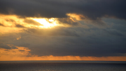 Naklejka na ściany i meble Dark morning clouds somewhere over the Carabbean Sea
