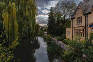 Fototapeta na wymiar Exterior of historical The Oxford Retreat pub, early nineteenth century building by river and trees, Oxford, UK