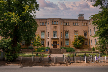 Fototapeta premium Exterior facade of department of plant sciences, with bicycles parked on street at University Of Oxford, England, UK