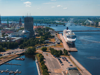 Huge cruise - Norwegian Dawn - ship docked in the center of Riga, Latvia. Aerial view of Riga city.