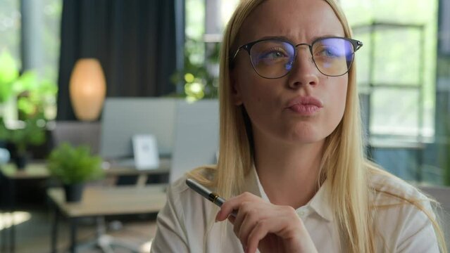 Portrait thoughtful puzzled girl student Caucasian businesswoman in glasses think business idea creative thoughts doubtful woman ponder solution solve problem in office brainstorm difficult question