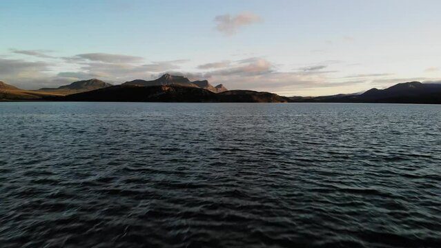 Aerial shot over water in the Kyle of Tongue with Ben Loyal in the background