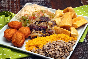 Northeastern Brazilian dish, with dried meat, acarajé, farofa, fried cassava and beans