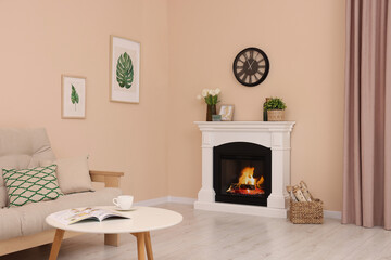 Stylish fireplace near comfortable sofa and coffee table in cosy living room