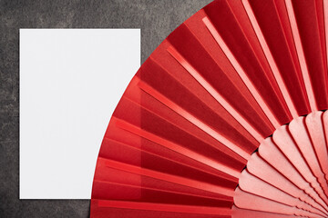 Red Chinese fan with empty paper for copy space
