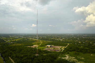 Aerial view of telecommunications cell phone tower with wireless communication 5g antennas for...