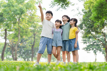 group of cute asian kids having fun in the park